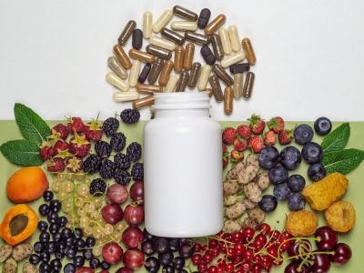 210373008-white-plastic-jar-with-dietary-supplements-or-vitamines-in-capsules-and-fresh-berries-transformed